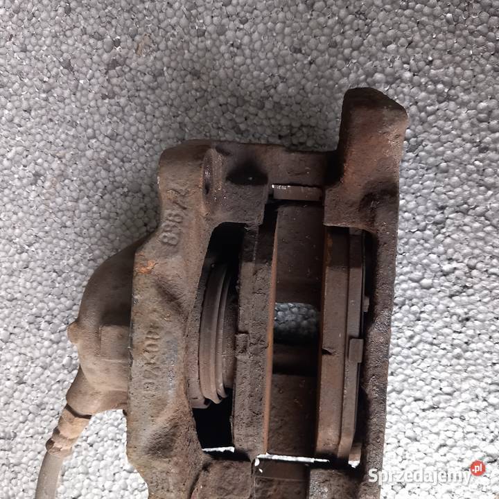 Lewy zacisk przód do Renault Scenic I Lift 19 osobowe