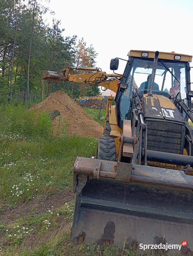 Usługi koparkoładowarką Cat 428D Pustków