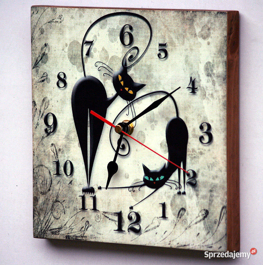 Zegar wsteczny z kotami cofający czas Kościerzyna