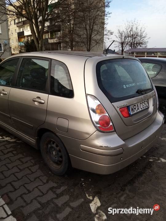 Suzuki Liana chatchback beżowy metal 16 Benzyna mazowieckie Pionki
