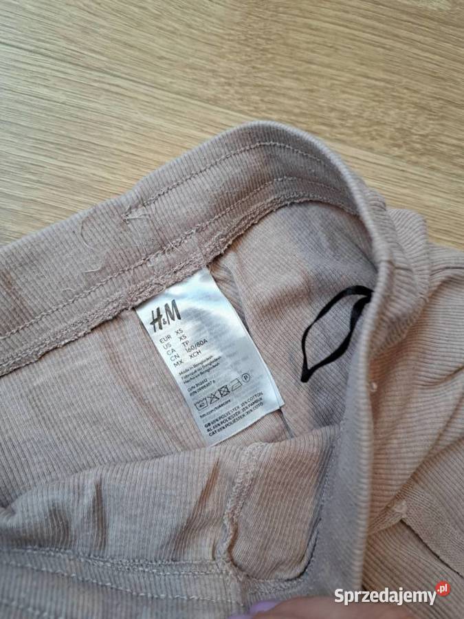 Beżowe spodnie prążkowane HM rozmiar XS Trąbki Wielkie