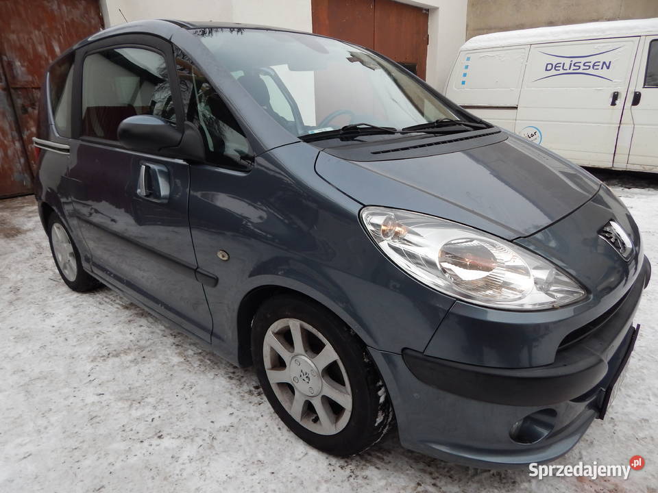 PEUGEOT 1007 BŁOTNIK PRAWY PRZEDNI EZW