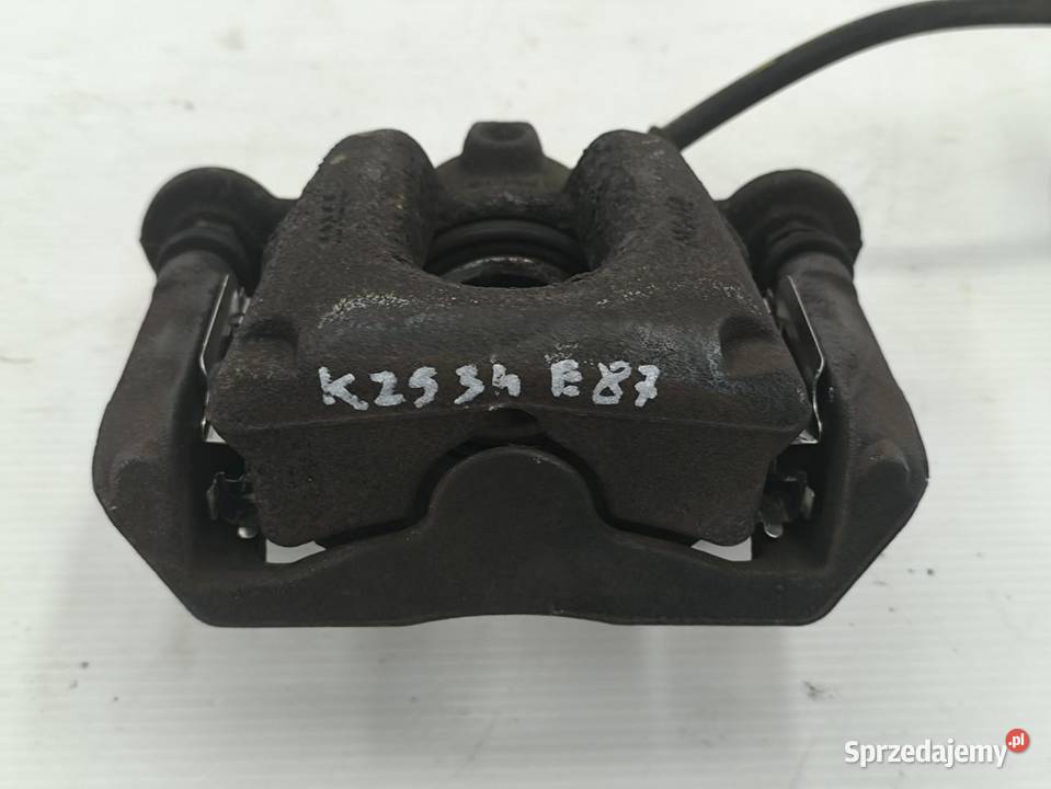 ZACISK LEWY TYŁ BMW 1 E87 E81 LIFT 16