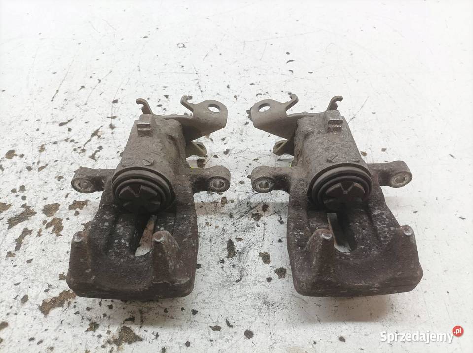 ZACISK HAMULCOWY PRAWY LEWY TYŁ KPL 15 DCI