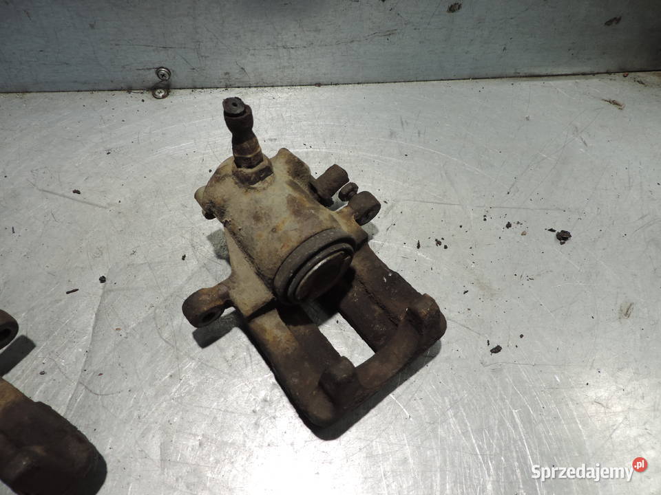 ZACISK HAMULCOWY PRAWY TYŁ AUDI 80 B4