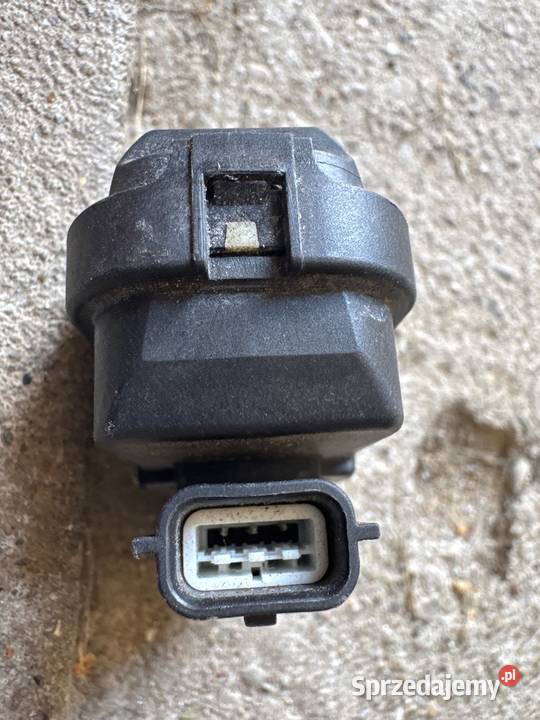 Silniczek regulacji lampy Nissan OE 90013783