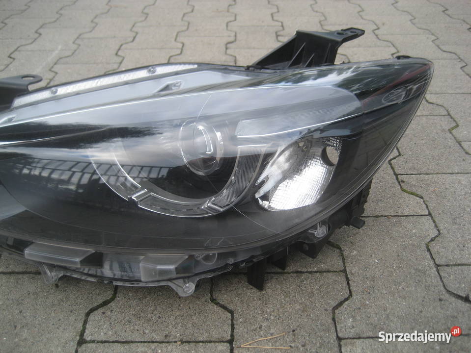 MAZDA CX5 LIFT 1517R LAMPA PRZÓD LEWA ka1f51040c osobowe Lampy przednie Rakoniewice