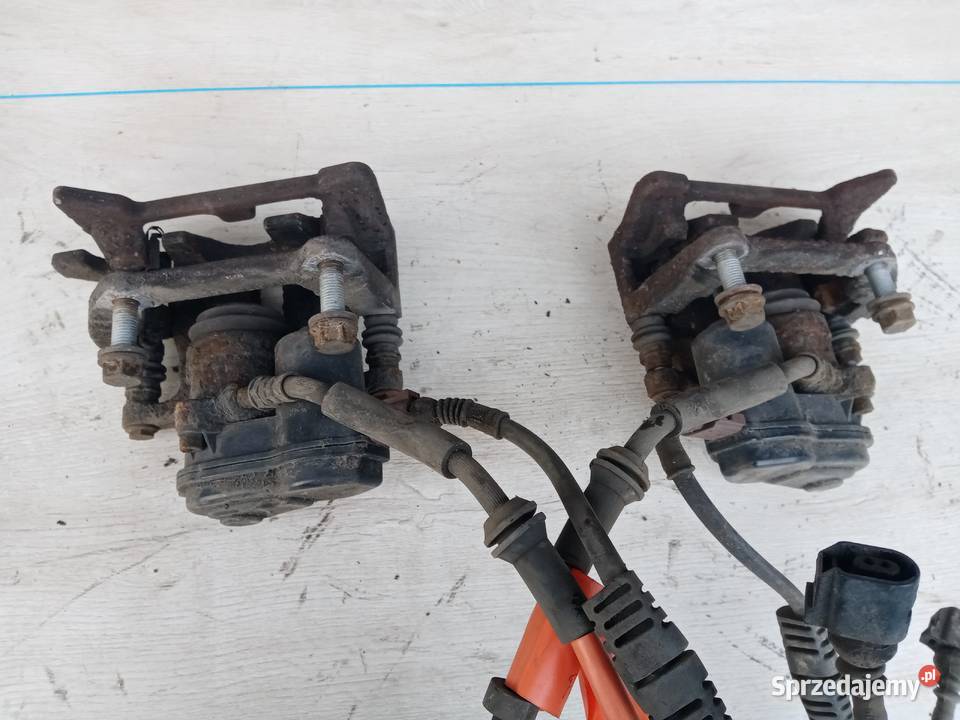 ZACISK TYŁ LEWY PRAWY AUDI A4 B8 SEDAN osobowe Święcany