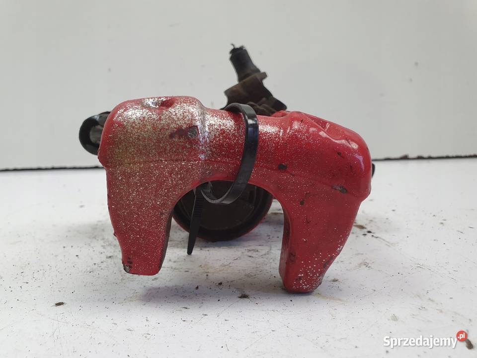 VW Golf VI LEWY TYLNY ZACISK HAMULCOWY tył