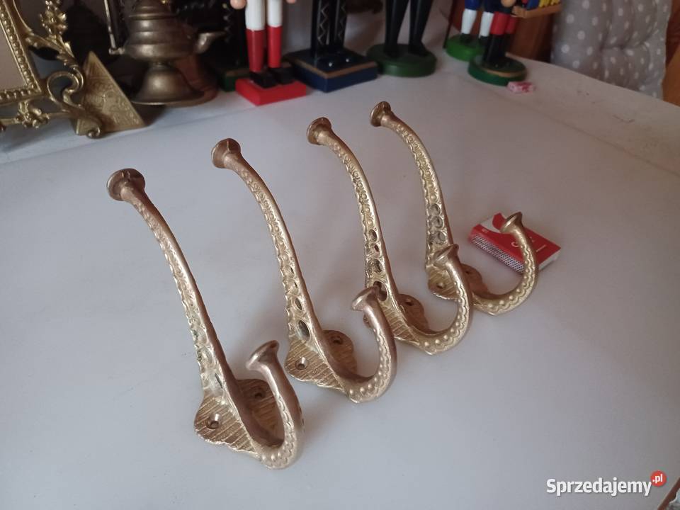 Komplet czterech masywnych wieszaków mosiężnych Pozostałe