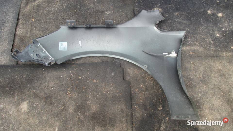 OPEL ASTRA J IV 10r błotnik prawy przód