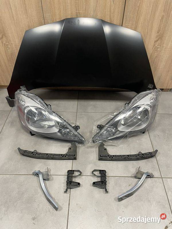 Honda Jazz II 09 reflektor przód nowy Motycz