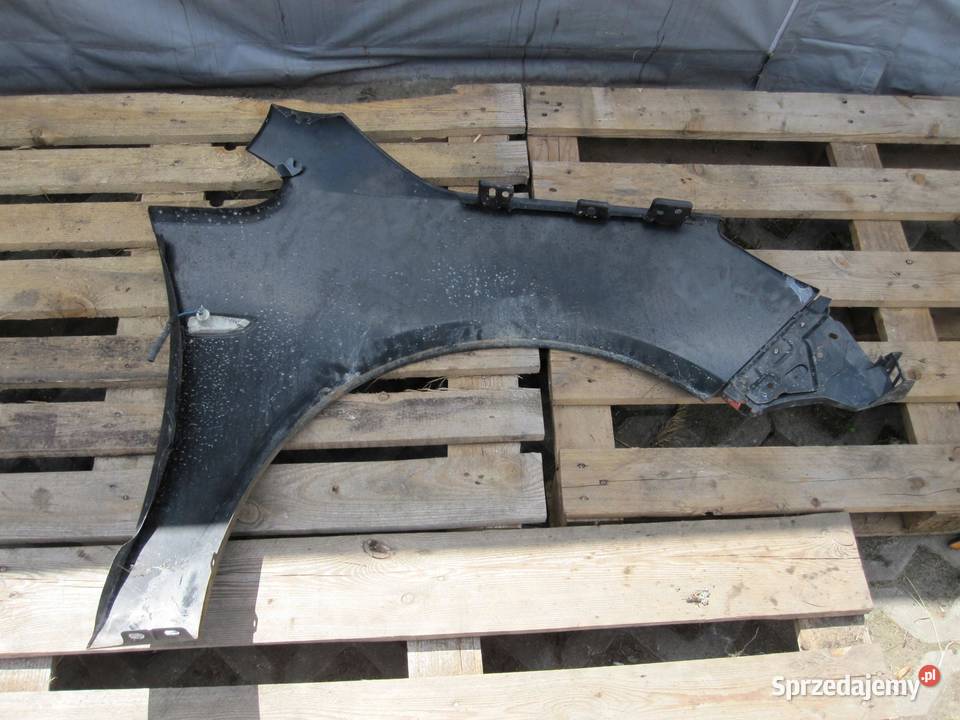 OPEL ASTRA J IV 11r błotnik lewy przód