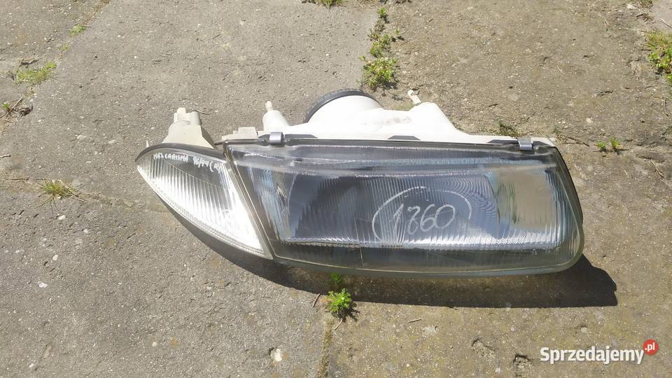Mitsubishi Carisma 1996 1999 lampa przód prawa Byków