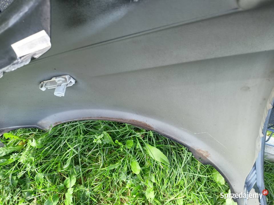 Błotnik prawy lewy Toyota Yaris P1 9905 kod Rok produkcji 2000 Motoryzacja