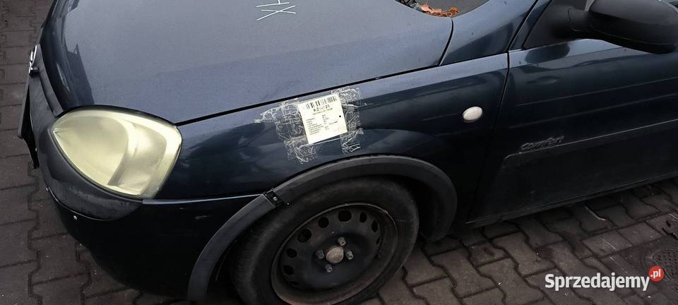 BŁOTNIK LEWY PRZÓD OPEL CORSA Z36U