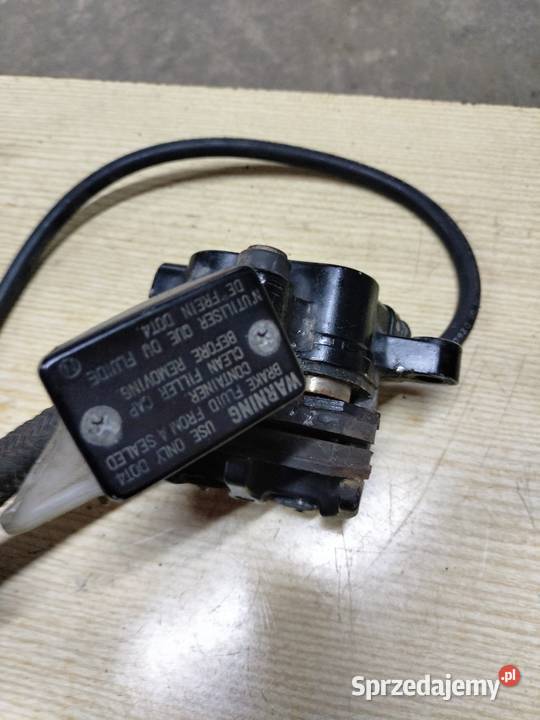 Zacisk hamulca tył pompa zbiorniczek wyrównawczy Łubno