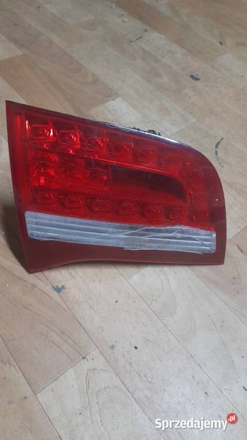 Lampa lewa klapy oprawka mocowanie audi a6 c6 osobowe Karpacz