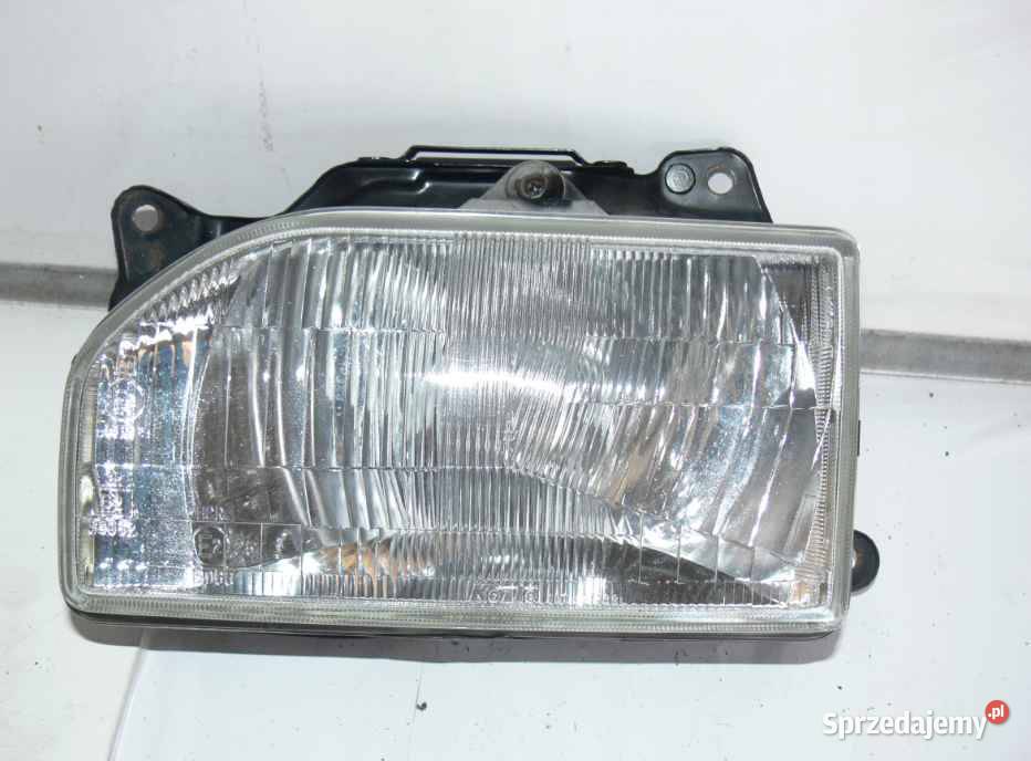 11061238 REFLEKTOR LEWY MAZDA 121 DA 89r KOITO