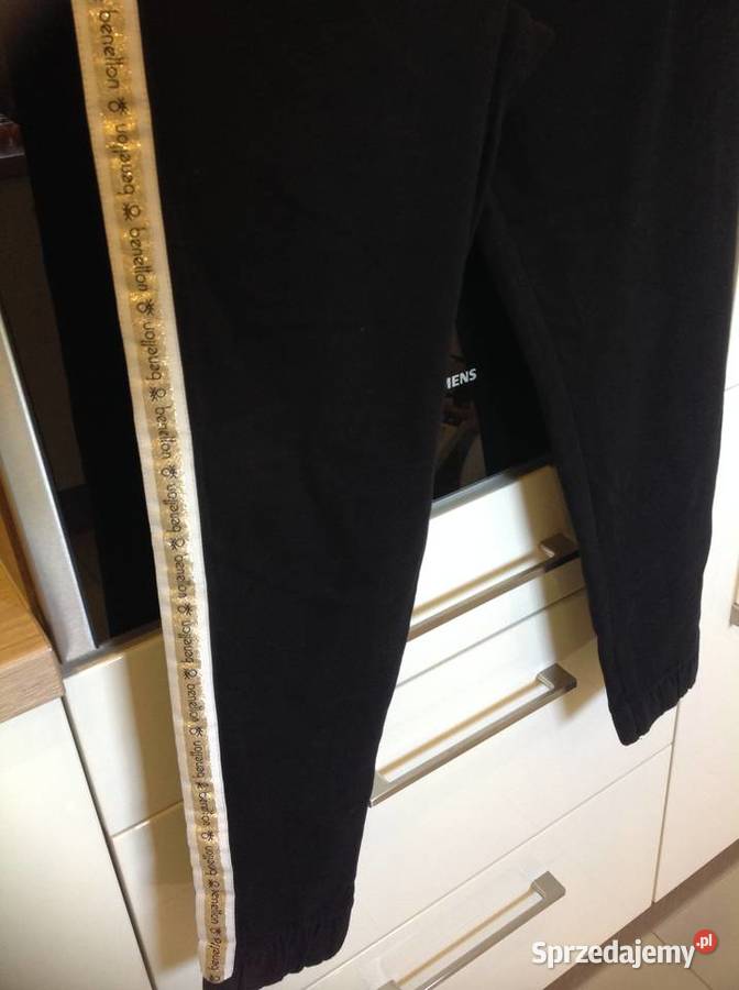Legginsy dresowe damskie BENETTON r XS złoty czarny Nowa Sól