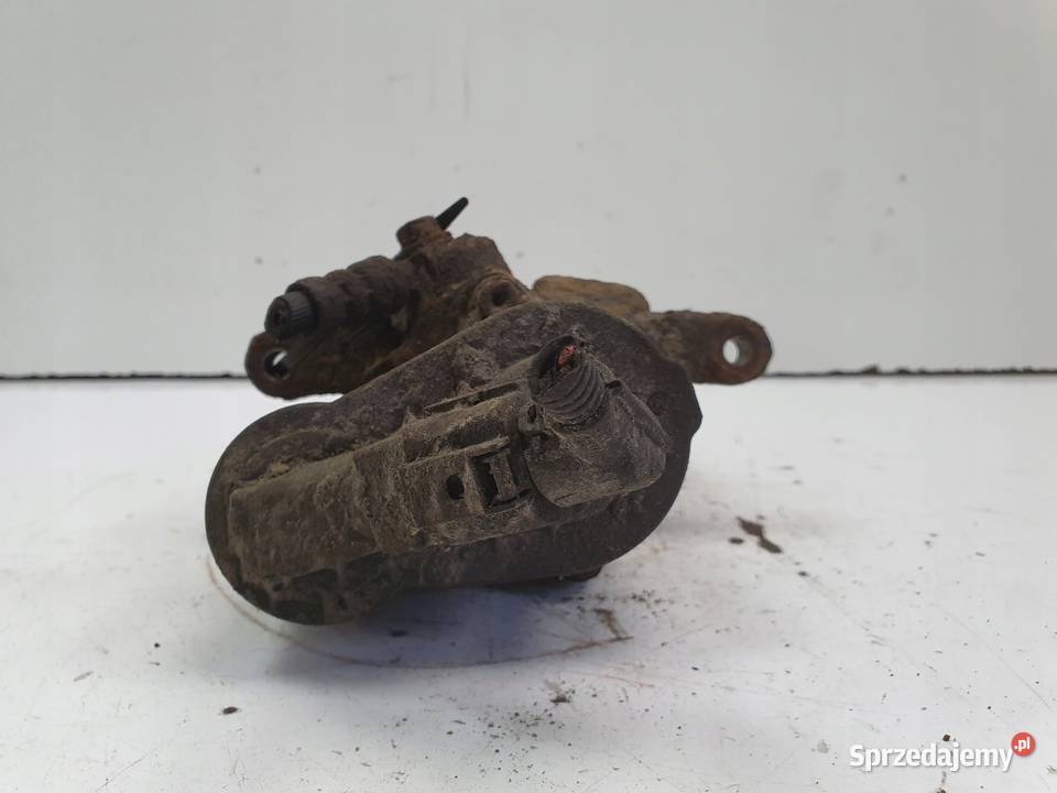 VW Passat B6 TYLNY ZACISK HAMULCOWY lewy tył