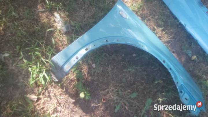 Blotnik przód lewy OPEL CORSA C zielony metalic Margonin