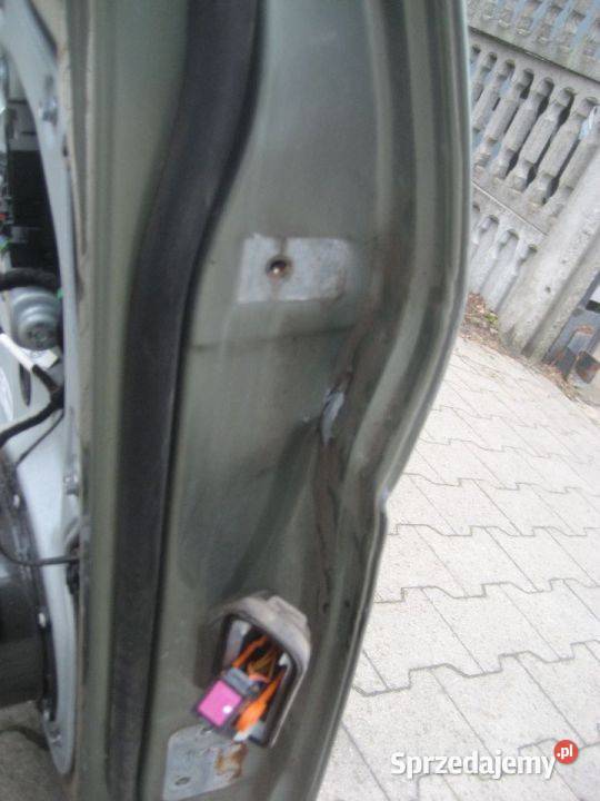 vw caddy 0314r drzwi przód lewe uszkodzone osobowe Rakoniewice