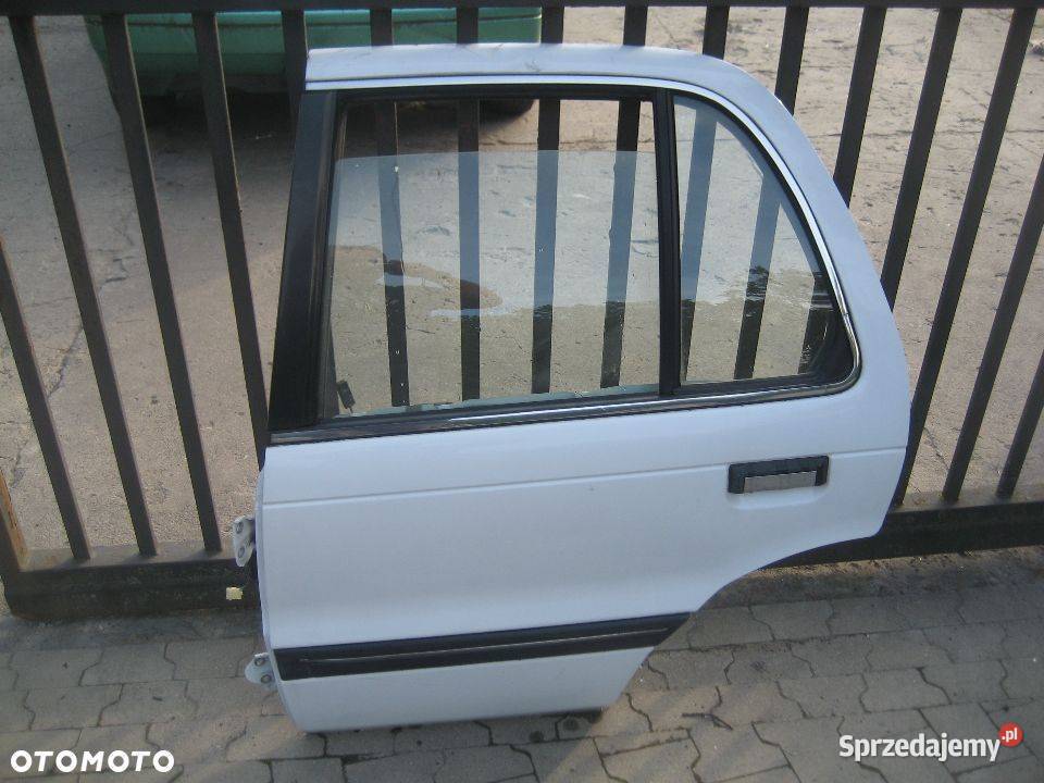 mitsubishi lancer 8891r drzwi tył lewe sedan Rakoniewice sprzedam
