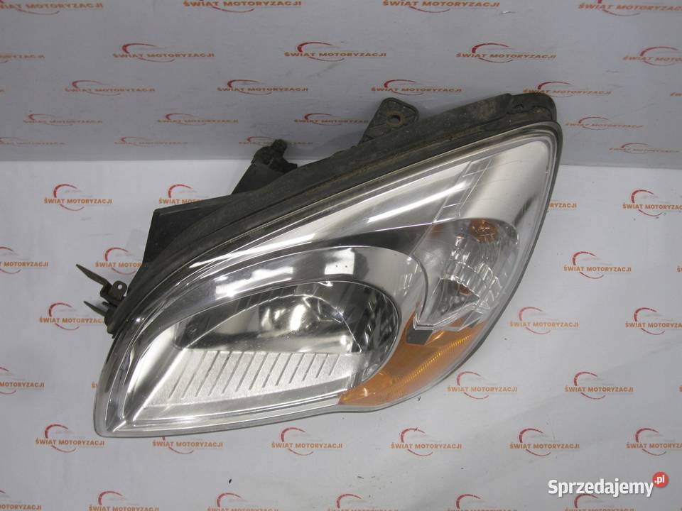 KIA SPORTAGE II LIFT 10r lampa lewa przód ANGLIK Lampy przednie