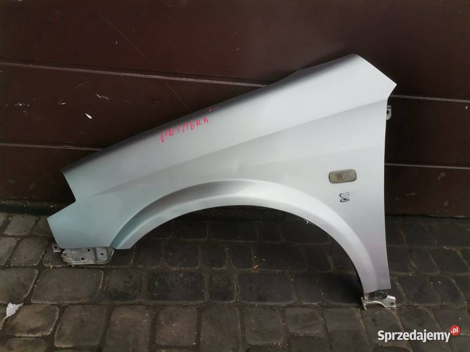 NISSAN PRIMERA P12 BŁOTNIK LEWY PRZEDNI KY0G Nowy Sącz