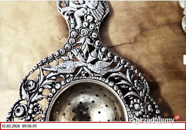 Srebrne sitko do herbaty z motywem puttów1900r Zgorzelec