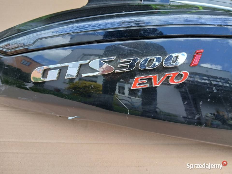 Zadupek emblemat Sym Gts 300i