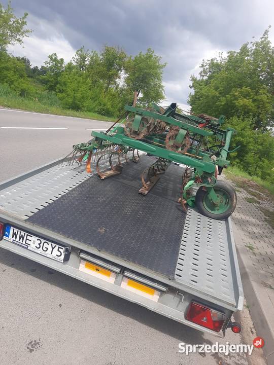 Wynajem lawety usługi lawetą przewóz aut maszyn Kock