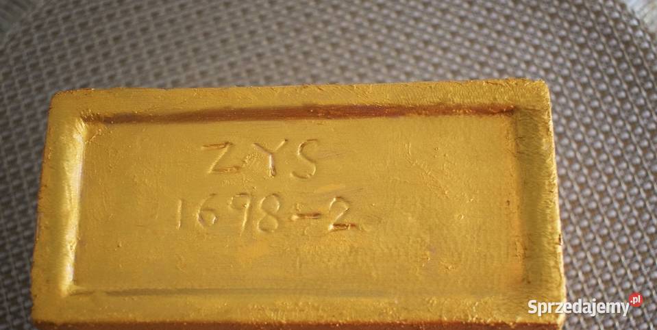 Złotawy ceramiczny pojemnik ozdobiony grafiką Chełmno