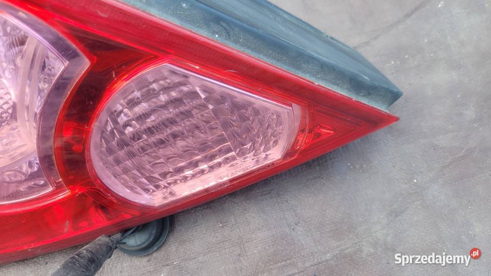 NISSAN TIIDA 5D LAMPA TYŁ LEWA 26555EM01A HELLA osobowe
