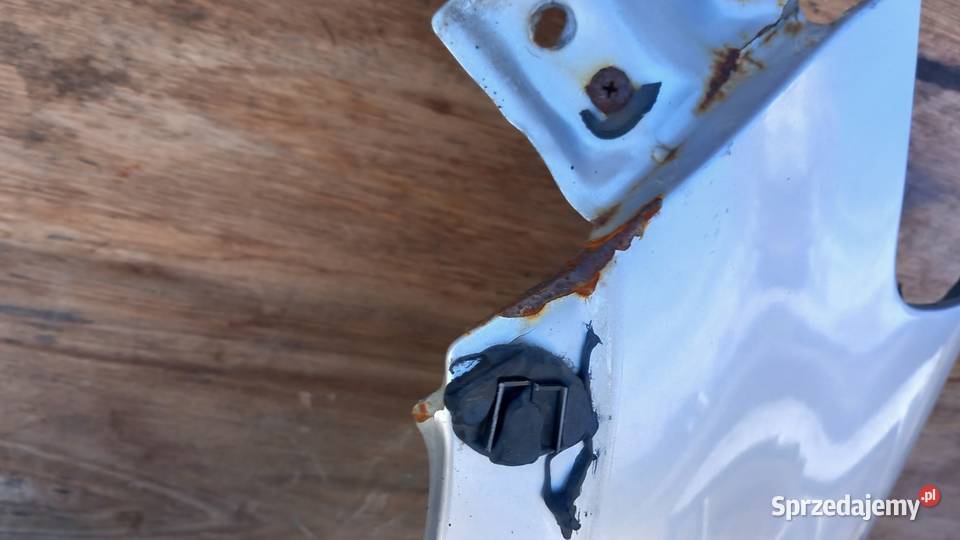 SUZUKI SX4 BŁOTNIK PRZÓD LEWY ZCC Zbierkowo