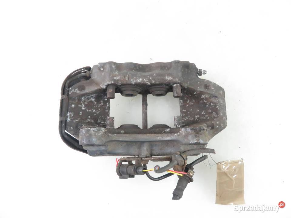 ZACISK LEWY TYŁ AUDI Q7 42 FSI 208930051A osobowe