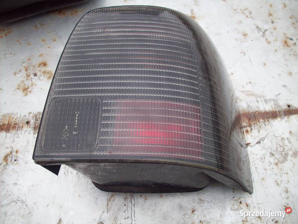 VW PASSAT B5 KOMBI lampy tył ciemne ori Lampy tylne Iława