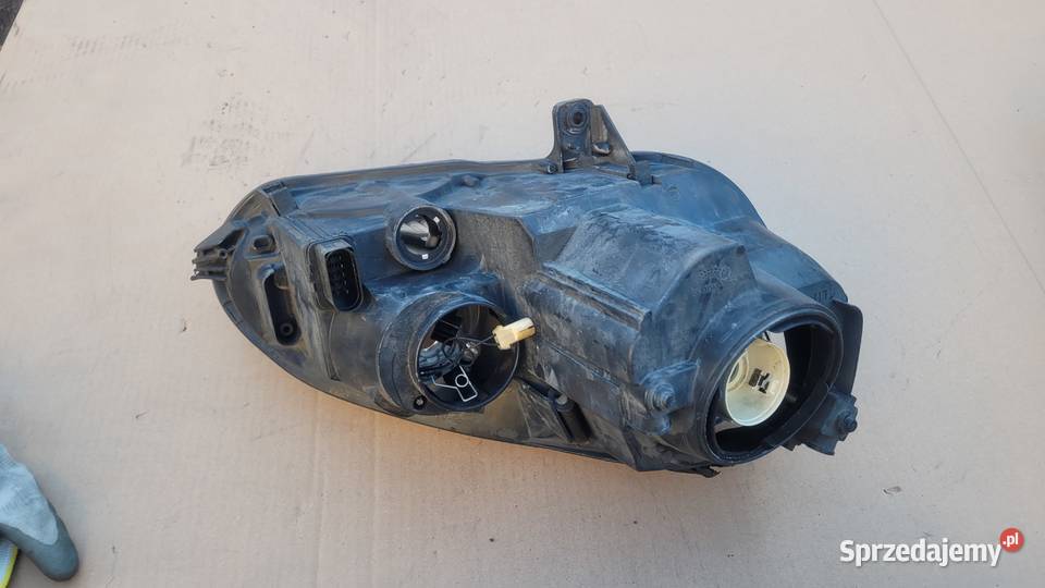 VW GOLF V 5 LEWY REFLEKTOR LAMPA LEWA PRZOD 747 Lampy przednie Ruda Śląska