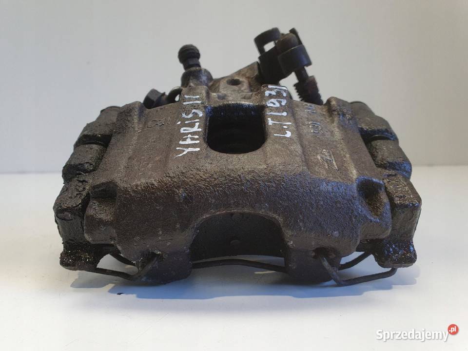 Toyota Yaris III TYLNY ZACISK HAMULCOWY lewy tył Rudka