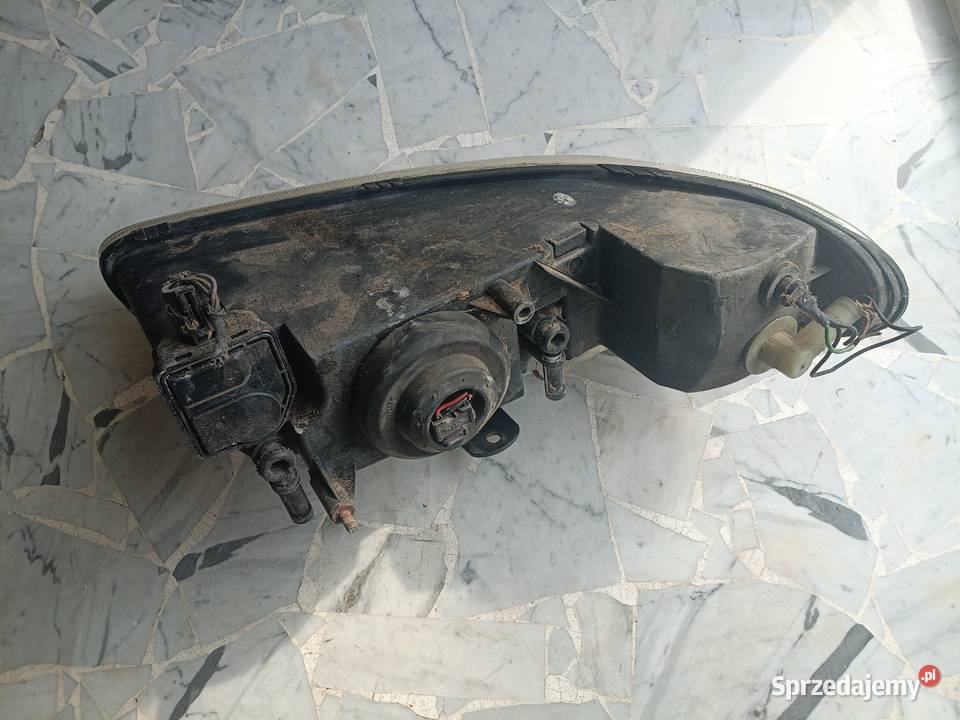 lampa chrysler grand voyager 1997 lewy przód Szydłowiec