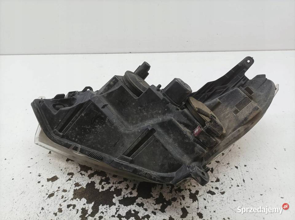 LAMPA PRZÓD 13239289 1EG27037042 Opel Astra III