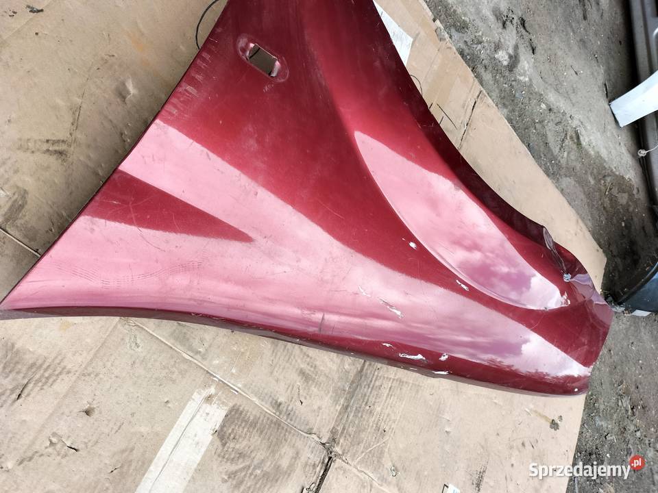 DACIA LOGAN I BŁOTNIK LEWY PRZÓD