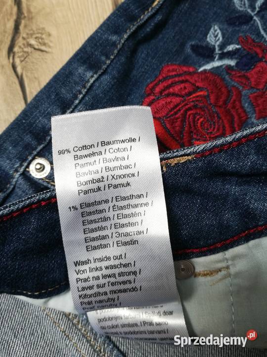 Damskie spodnie jeans z haftami róż nowe