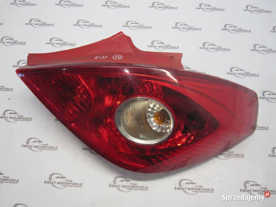 OPEL CORSA D lampa prawa tył 13211841 89038963A