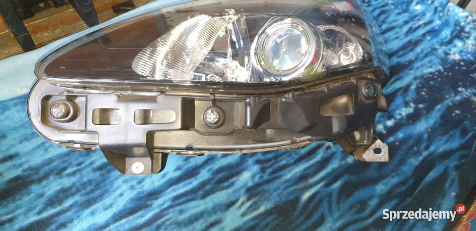 Renault Clio III lewa lampa soczewka 260606716R osobowe Przygodzice