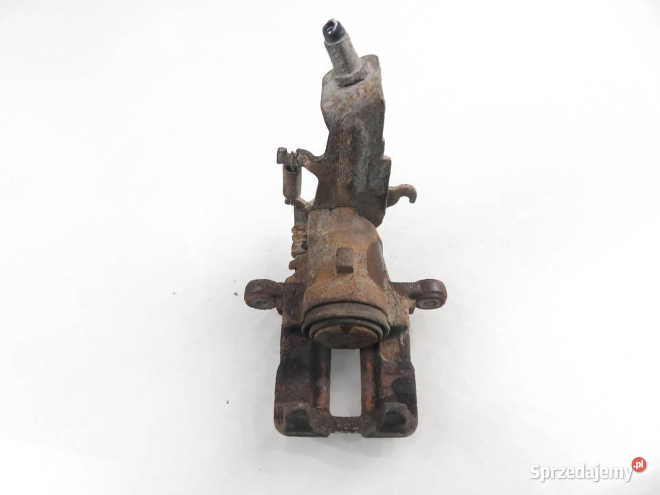 ZACISK LEWY TYŁ NISSAN ALMERA II N16