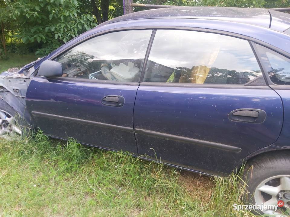 Mazda 323F drzwi komplet boczki siłowniki śląskie Wojkowice sprzedam