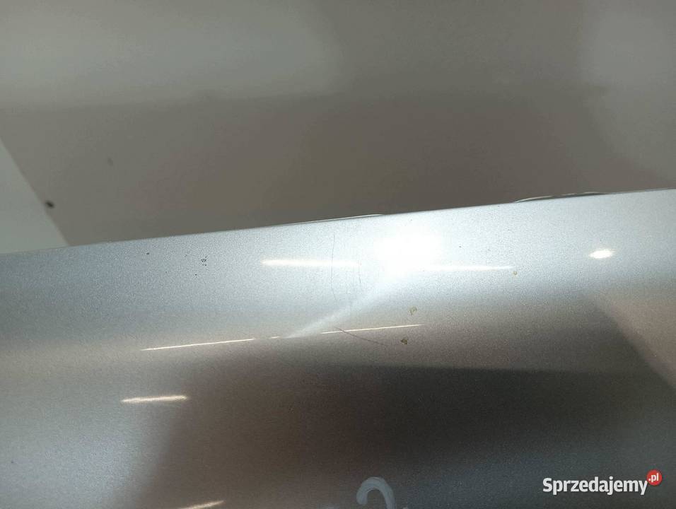 BŁOTNIK PRAWY PRZÓD SREBRNY Opel Astra III