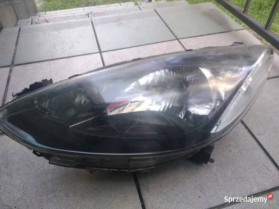 Mazda 2 0714 lampa reflektor lewa przednia przód Oświetlenie Ślesin